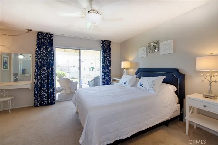 Grand master bedroom with extraordinary views, slider to the back yard, make-up station and walk-in closet.