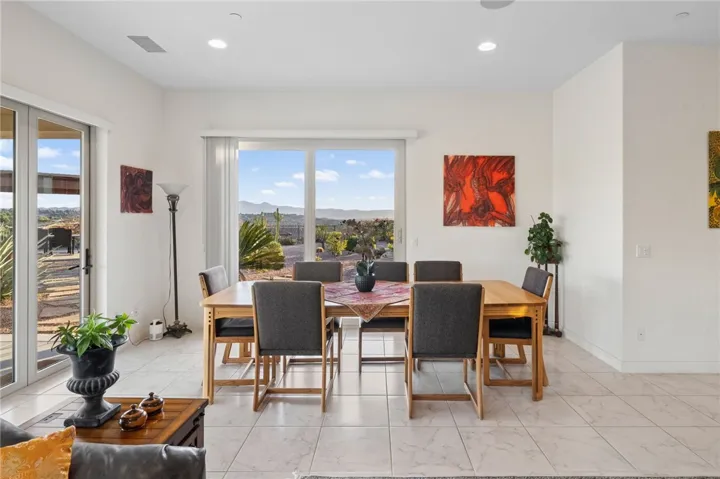 Bright dining space is positioned to enjoy backyard views and easy access to outdoor entertaining areas.