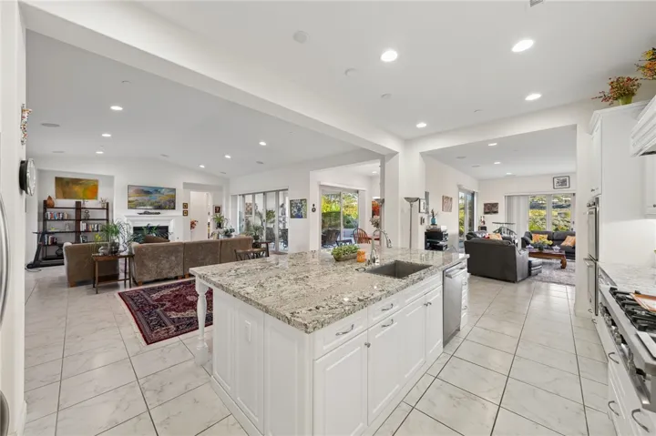 Expansive kitchen offers ample prep space, abundant storage, and an easy connection to the surrounding living areas.