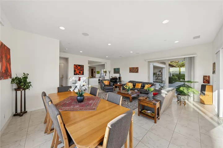 Open dining and family room layout offers flexibility, natural light, and a welcoming setting for gatherings.