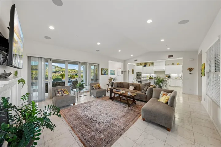 Open living area flows into the dining space and outdoor access, offering a bright and versatile setting for daily living.