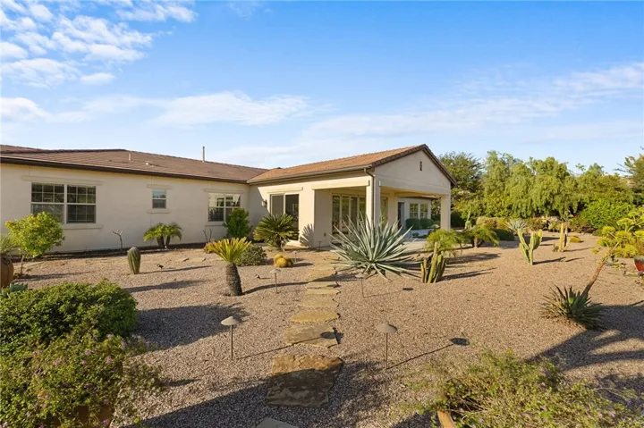 Spacious covered patio offers a comfortable shaded retreat with seamless access to the home’s interior living spaces.