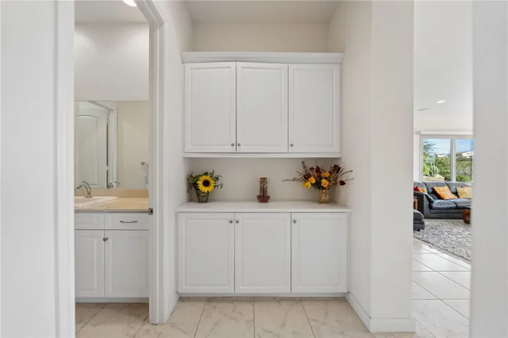 Hallway built-ins provide convenient extra storage and countertop space, adding both function and organization.