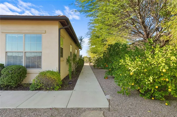 Low-maintenance backyard features walking paths, mature plantings, and open views across the surrounding hills.