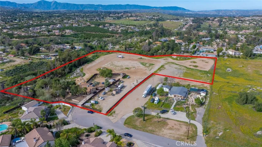 Red outline indicates approximate property lines only.