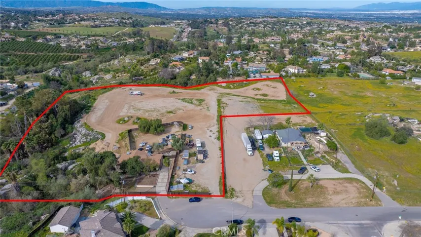Red outline indicates approximate property lines only.