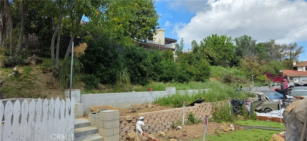 Property goes up the slope.  Appx 1/2 acre in total.