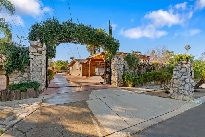 Welcome to 19160 Ingomar - 21974 sq ft lot nestled behind an electric wrought iron gate