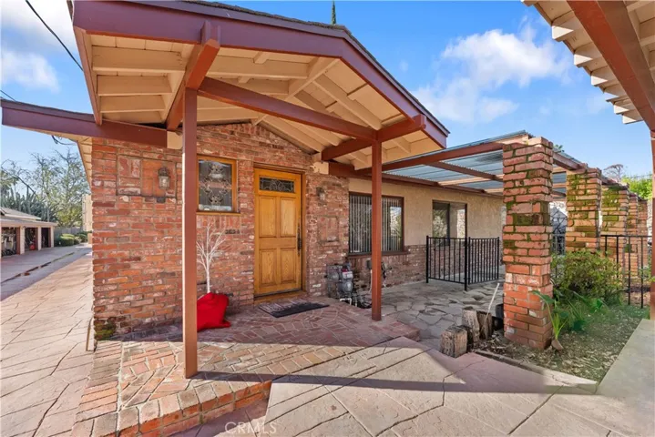 Rustic exterior with wood & used brick accents
