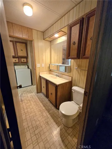 Second bathroom off second bedroom and laundry room.
