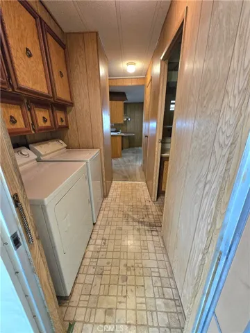 View into laundry and kitchen from carport door.