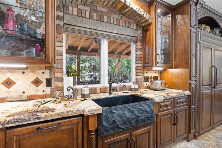 Indoor Kitchen over looking outdoor kitchen