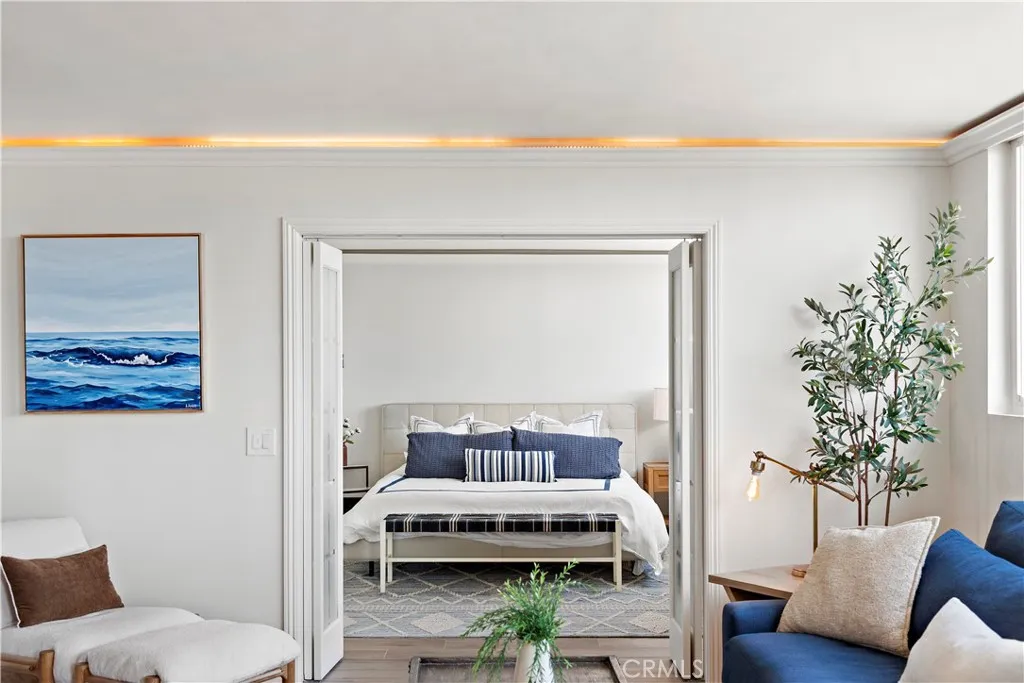 Enter the primary through elegant French doors