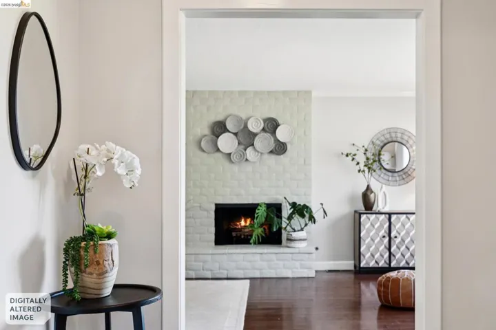 Living area with dark wood-style flooring and a brick fireplace