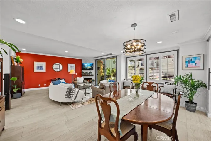 View of dining and living space from entryway entryway.