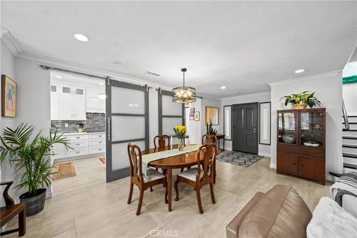 Modern slider doors between kitchen and living room for an extra design touch.