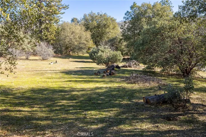 Large flat area of useable space to the right of the driveway as you enter the property