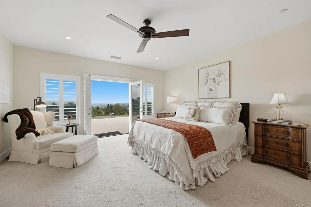 Primary Bedroom Suite has access to a back patio with view of the countryside.