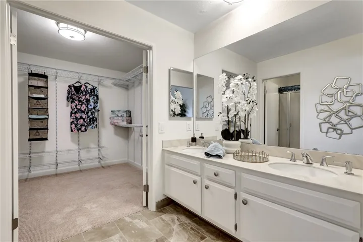 Primary Bedroom walk-in Closet - pic 1