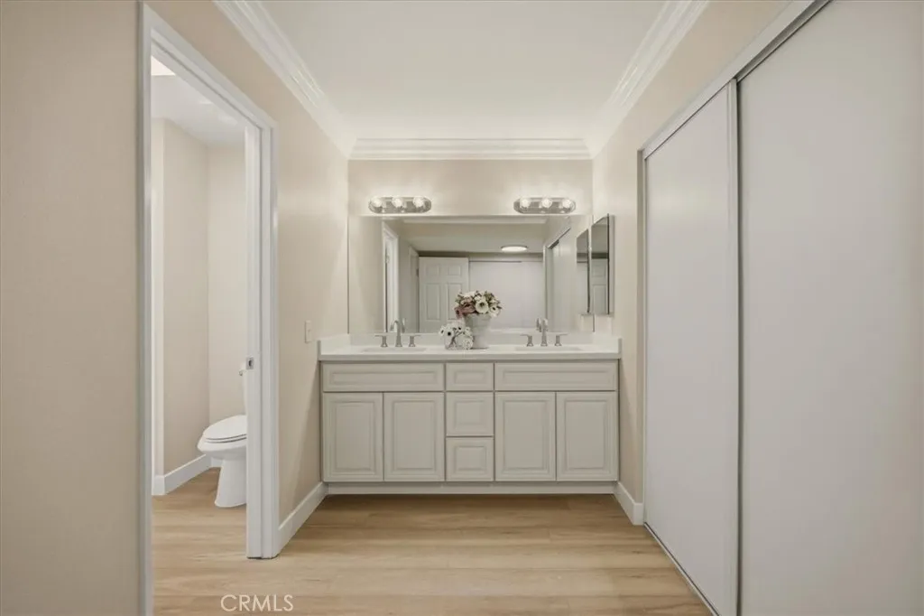 Completely remodeled primary vanity area with two closets.