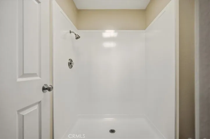 Re glazed walk in primary shower with new fixtures.