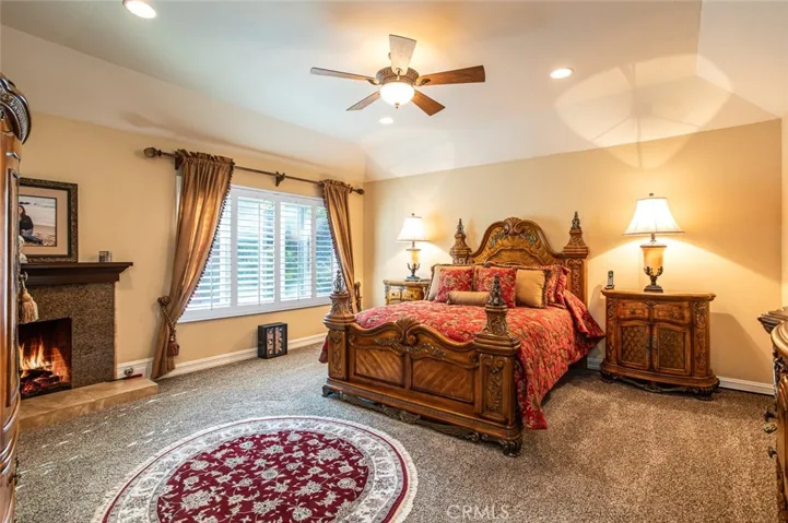 Master Suite with HIGHLY desired fireplace with granite surround and elegant mantle