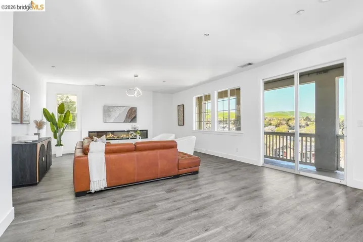 Living area featuring baseboards and wood finished floors