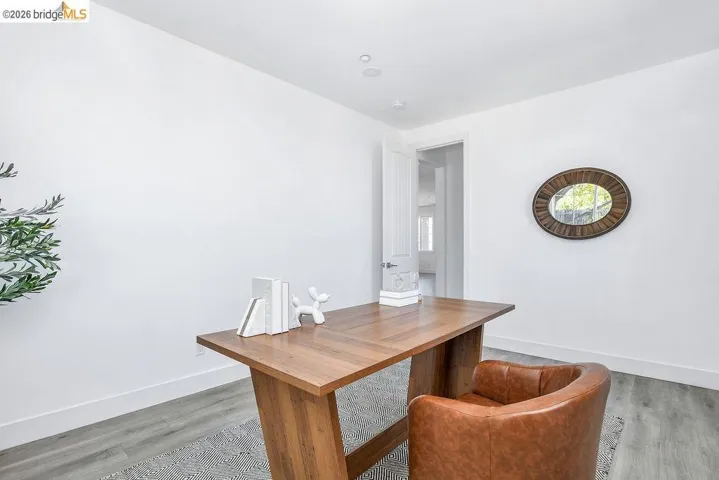 Office area featuring light wood-type flooring and baseboards