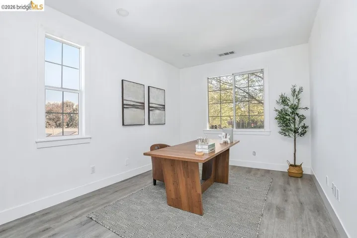 Office featuring light wood-style flooring and baseboards