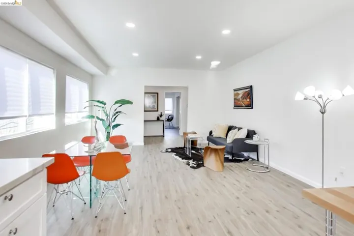 Living room featuring light wood-type flooring and recessed lighting
