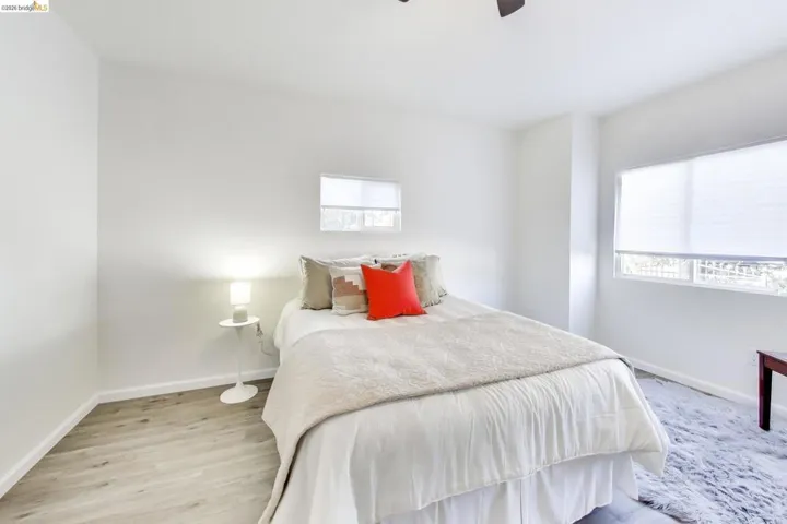 Bedroom featuring light wood-type flooring and ceiling fan