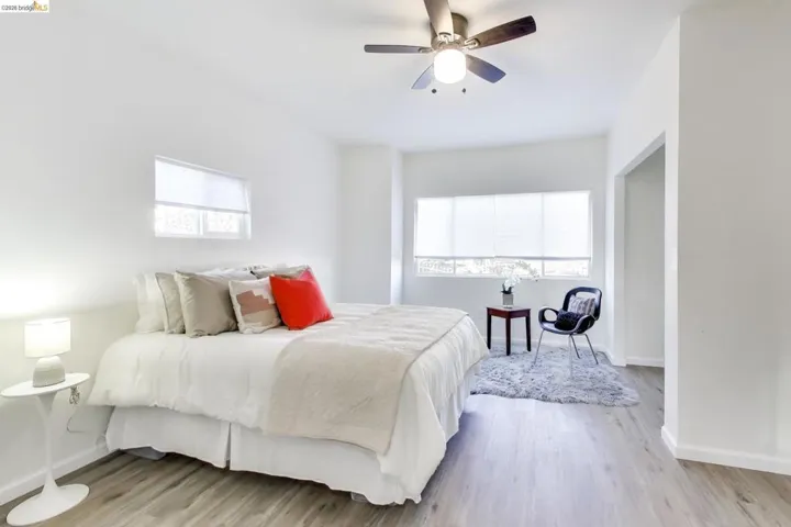 Bedroom with light wood-style flooring and ceiling fan