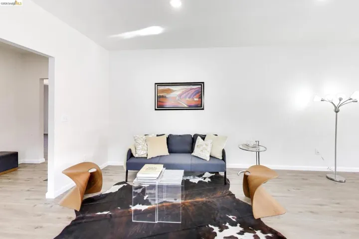 Living room with wood finished floors and baseboards