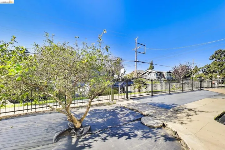 View of basketball court with a residential view