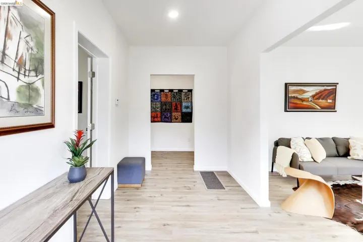 Hall featuring light wood finished floors and baseboards