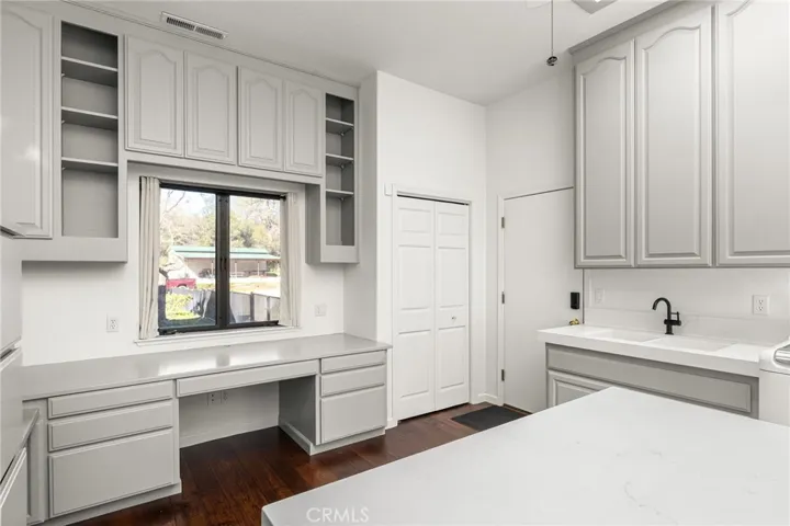 Oversized Laundry room with utility sink.