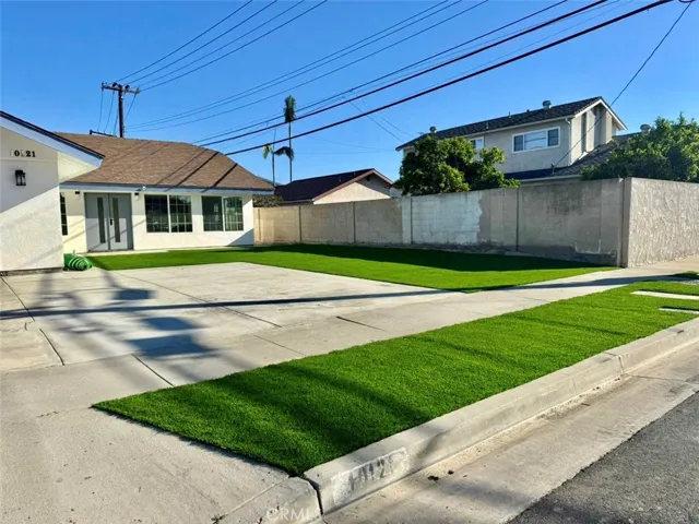 Front of home #2 with artificial grass