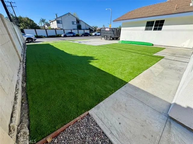 Front of home #3 with artificial grass