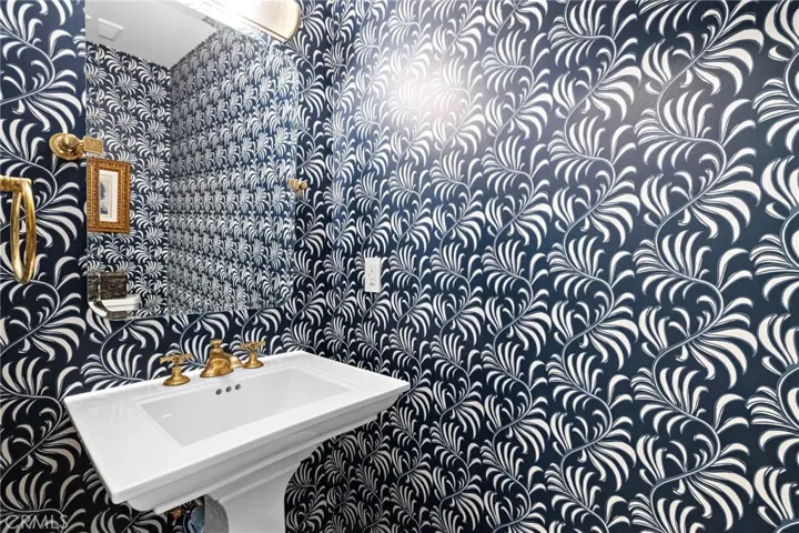 Powder room for guests...Love the wall paper!