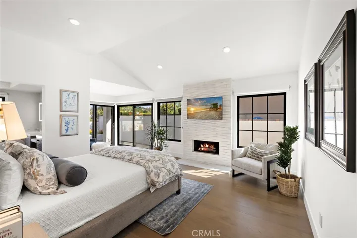 Enter the primary bedroom suite complete with gas log fireplace.