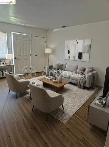 Living area featuring wood finished floors and baseboards