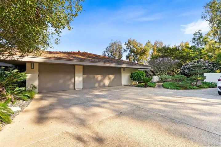 3 car garage with EV charger and small workout area