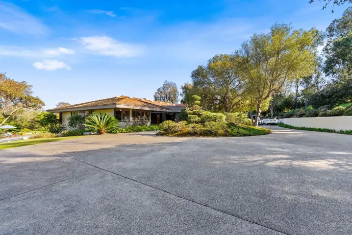 Large outdoor driveway with lots of parking for guests and family!