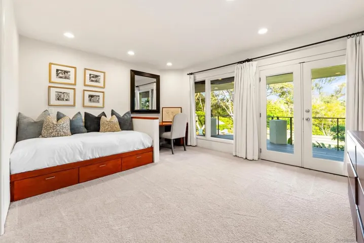 Guest bedroom with en suite bathroom and dedicated work area.  Queen size bed