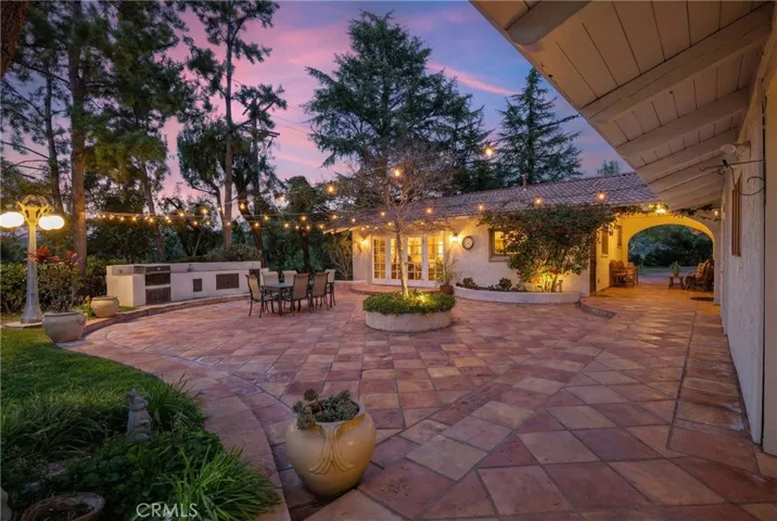 String lights over patio with built-in BBQ