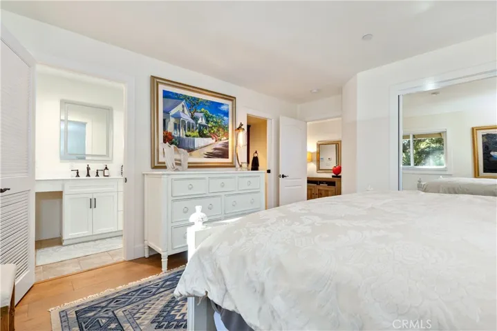 Private ensuite bathroom paired with a separate vanity space enhances convenience and everyday ease.