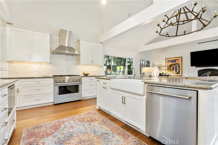 Spacious kitchen featuring upgraded appliances, blending a warm farmhouse aesthetic with timeless modern finishes.