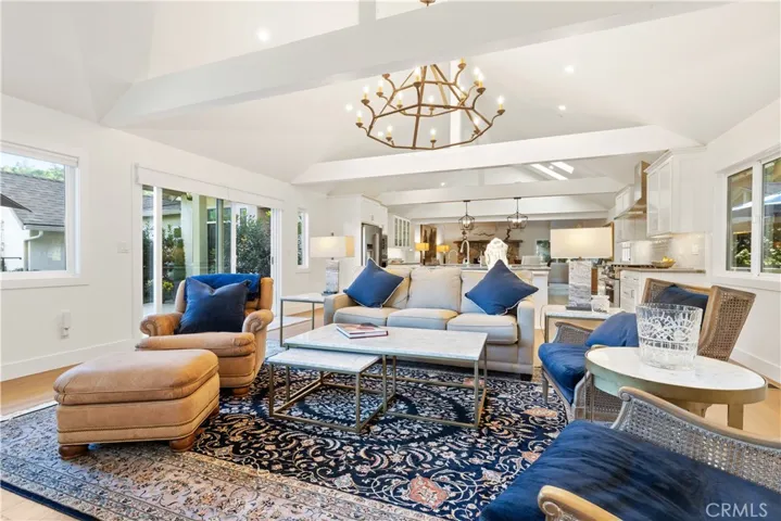 Large sliding doors extend the great room outward, leading directly to the front seating area.