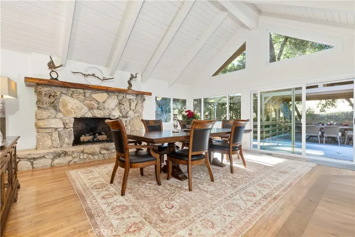 Natural light fills the living spaces, with direct access to the back deck for seamless indoor-outdoor entertaining alongside Sheep Camp Creek.
