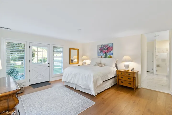 Primary bedroom with direct access to a private patio.